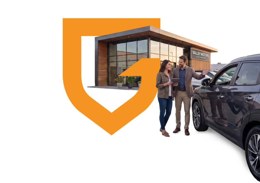 Dealer and customer outside a dealership inside the GWC shield